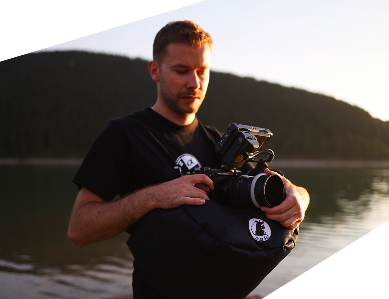 Man Holding Navy Blue Steady Bag with Camera on it